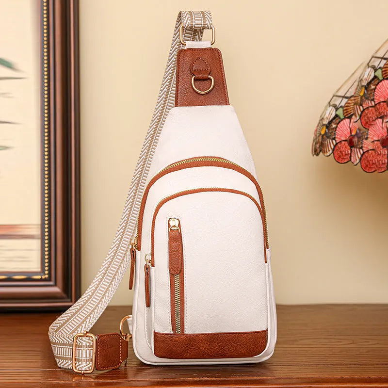 Women's soft PU leather chest bag with crossbody strap and organised interior compartments