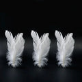 Tumbler funny cat artifact toy in pink with replacement feathers, made from ABS plastic, on a light background