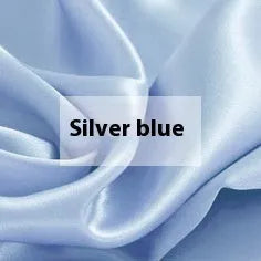 Double-sided silk duvet cover in a solid colour, shown in bright brown on a bed.