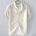 Man wearing a loose fit apricot coloured short sleeve linen blend casual shirt.