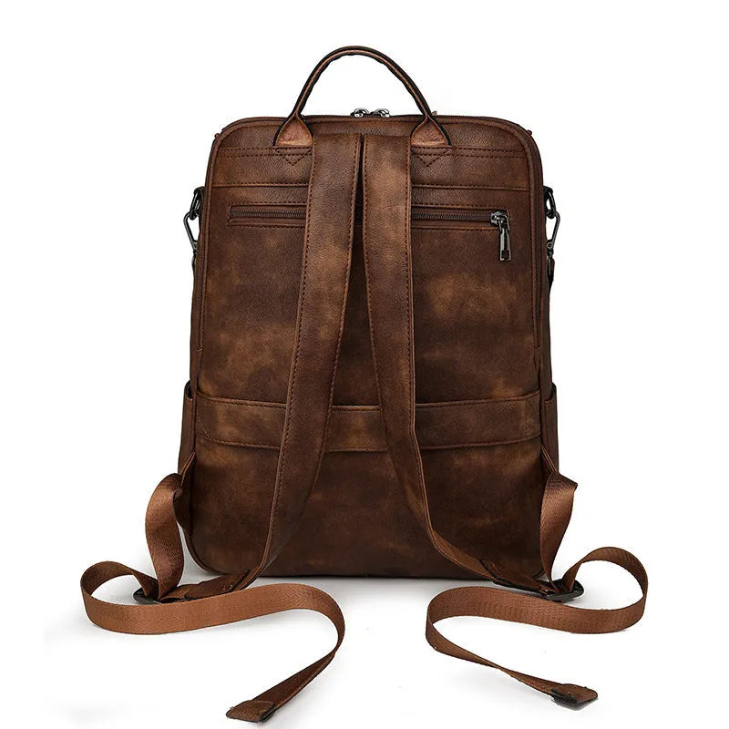Retro college student backpack in black with curved shoulder straps and stitching detail