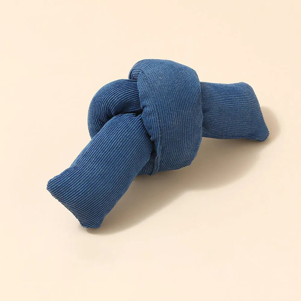 White knotted cotton rope dog toy for tugging and chewing.