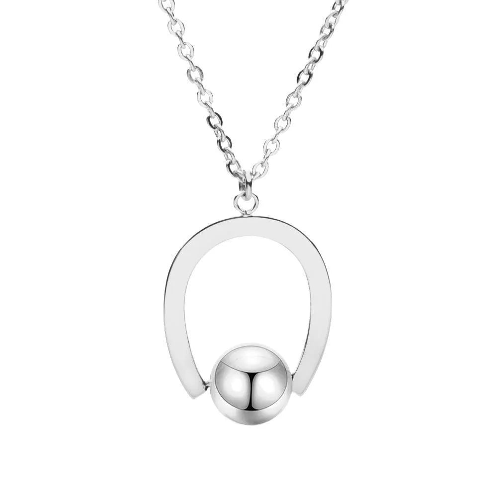 Gold or silver electroplated stainless steel geometric pendant necklace on a cross chain.