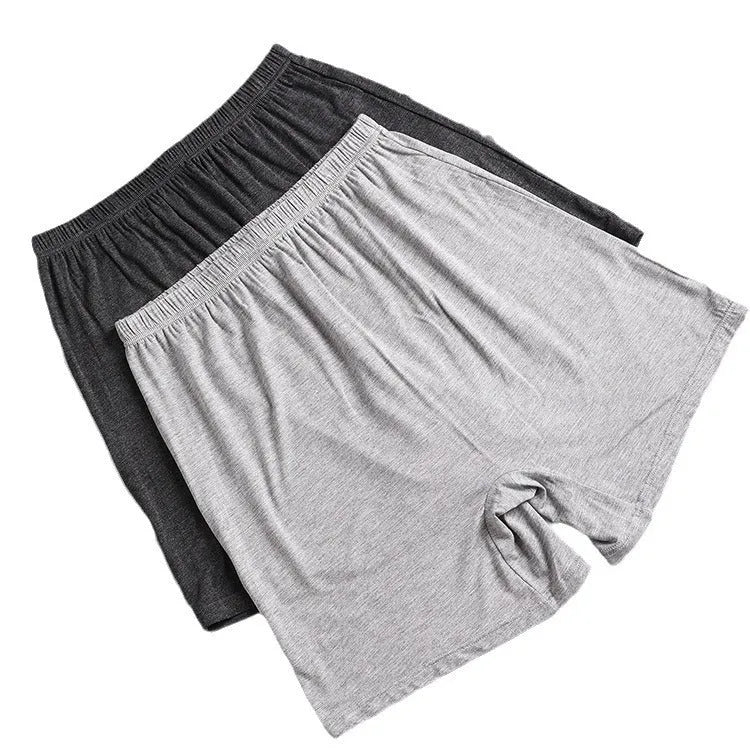 Men's solid colour modal boxers on a white background, showing high-waist design in black, blue, and gray.
