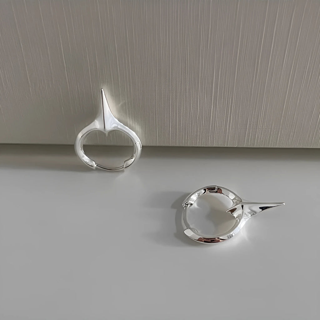 Women's geometric star-shaped ear clip earrings with a copper white gold electroplated finish.