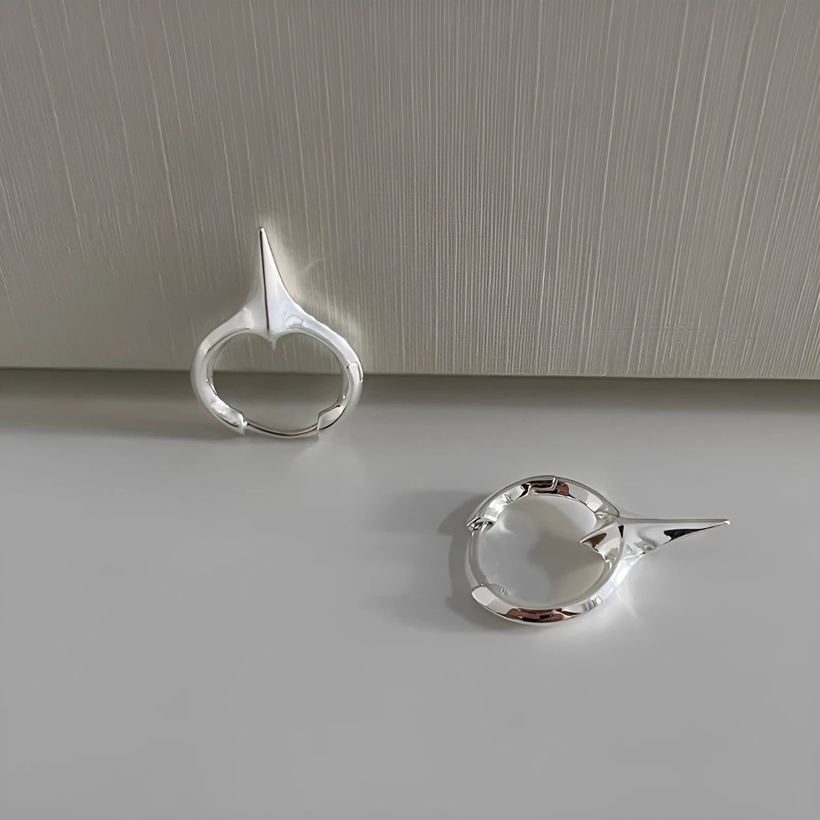Women's geometric star-shaped ear clip earrings with a copper white gold electroplated finish.
