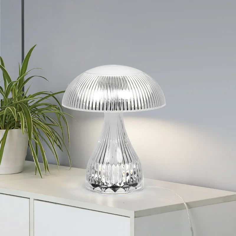 Small white touch-control night lamp with USB charging cable on wooden surface