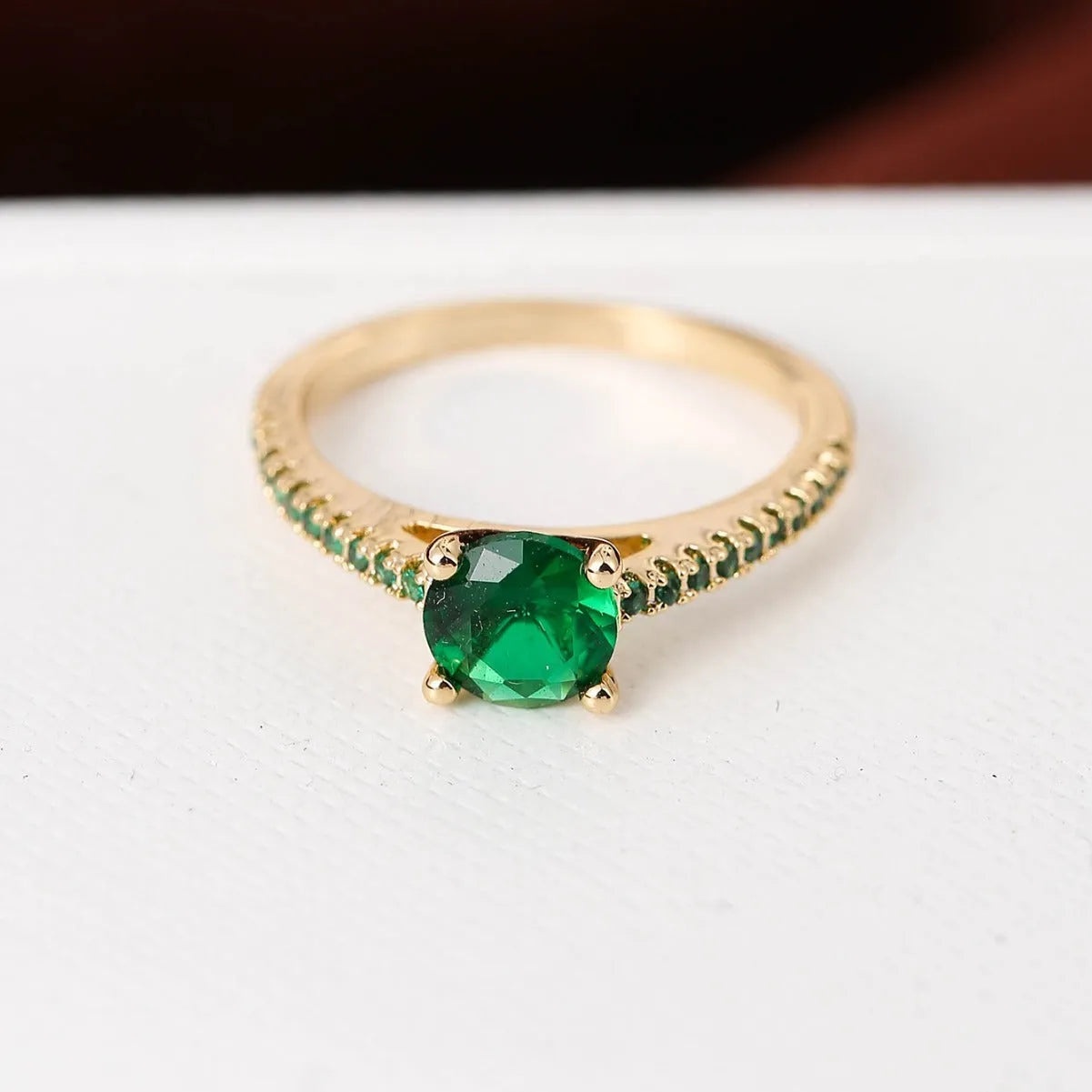 Hexagonal geometric zircon ring in copper with electroplated finish showing angular design and zircon stone