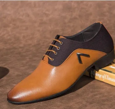 Men's black Oxford shoe with a low upper and rubber sole on a white background.