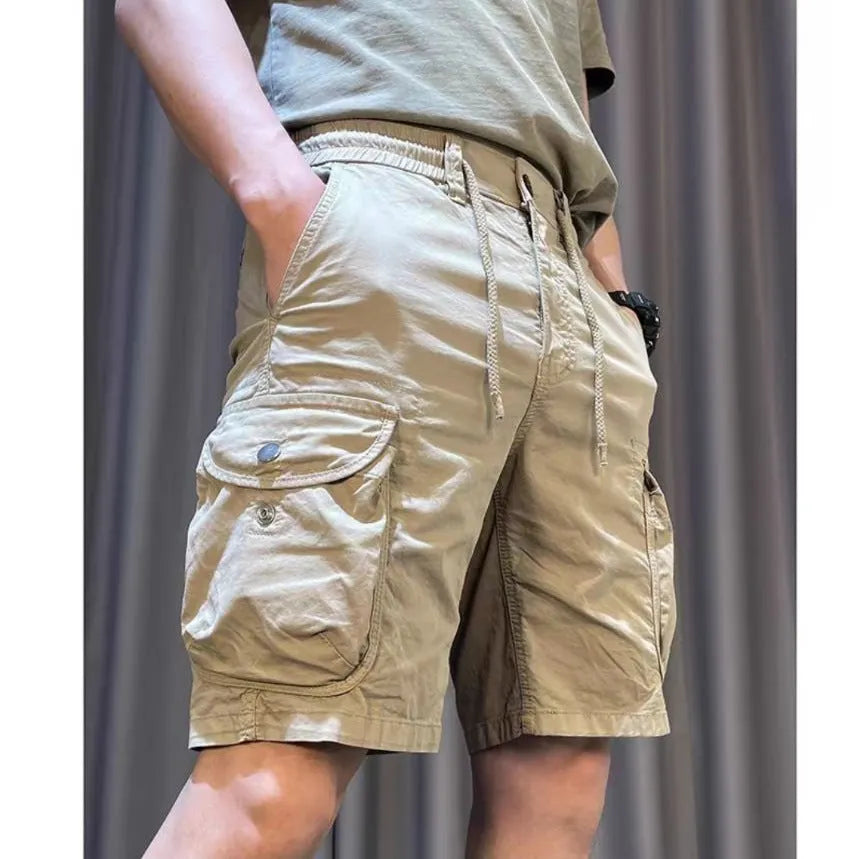 Loose straight casual overalls pants in black colour with multiple pockets and elastic waistband.