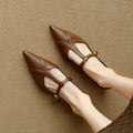 Brown women's pointed toe flat shoes with a low-cut design and a mid-height heel.
