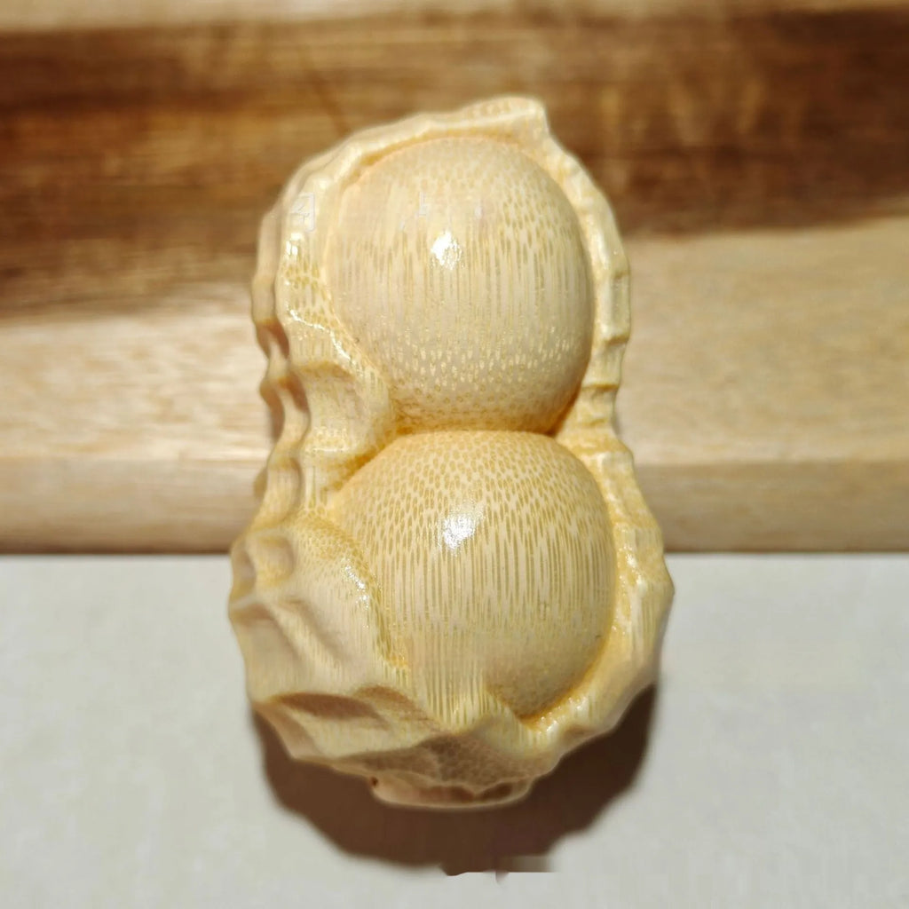 Natural solid bamboo peanut ornament with carving detail and modern simple style