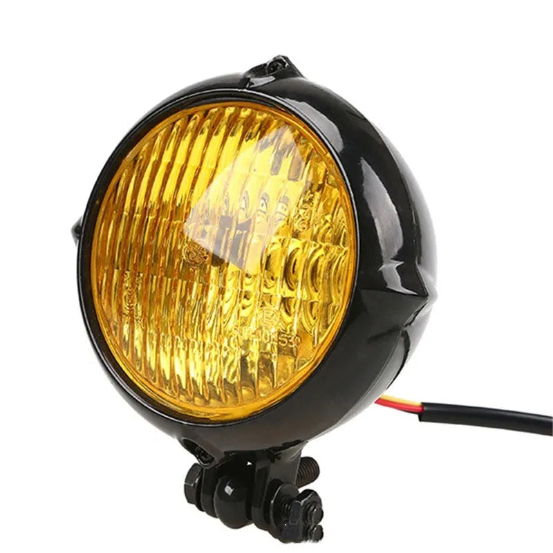 Black electroplated Harley-style halogen headlight with an 8 cm diameter lens.