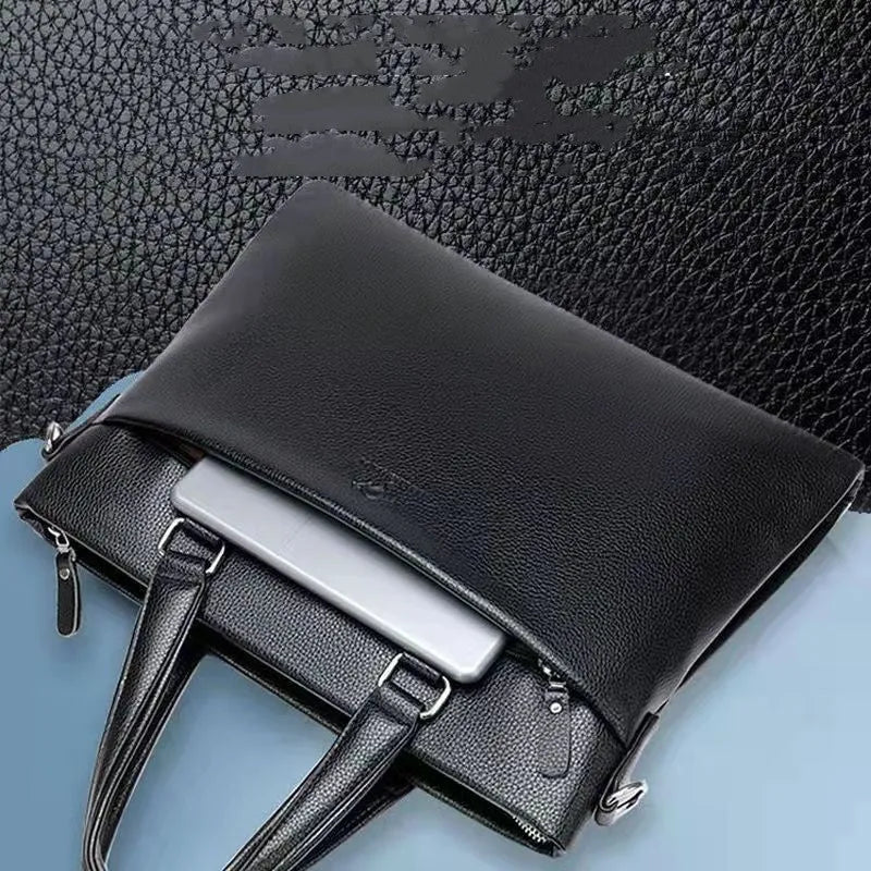 Black PU leather men's shoulder messenger bag with splicing style, shown next to a laptop