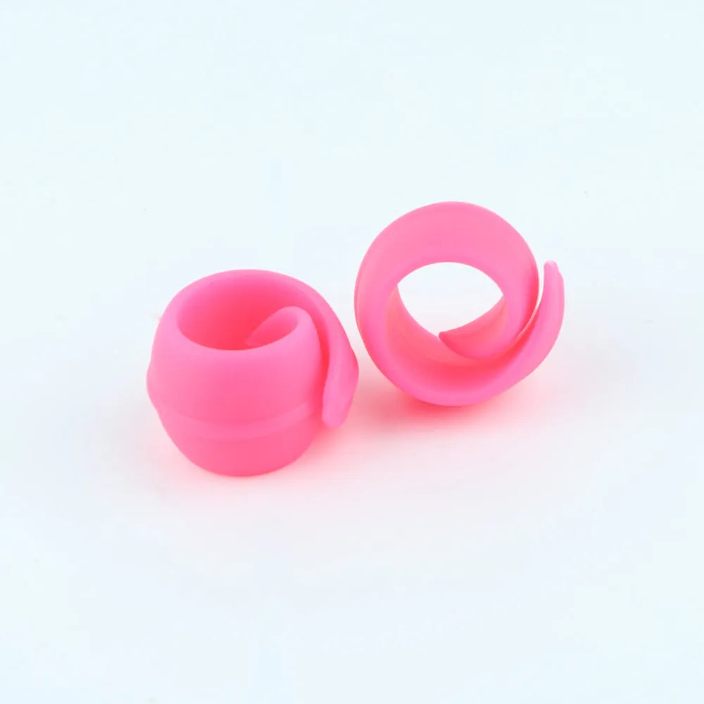 14 silicone sewing spool fixed clips in red, blue, orange, and green on a white background