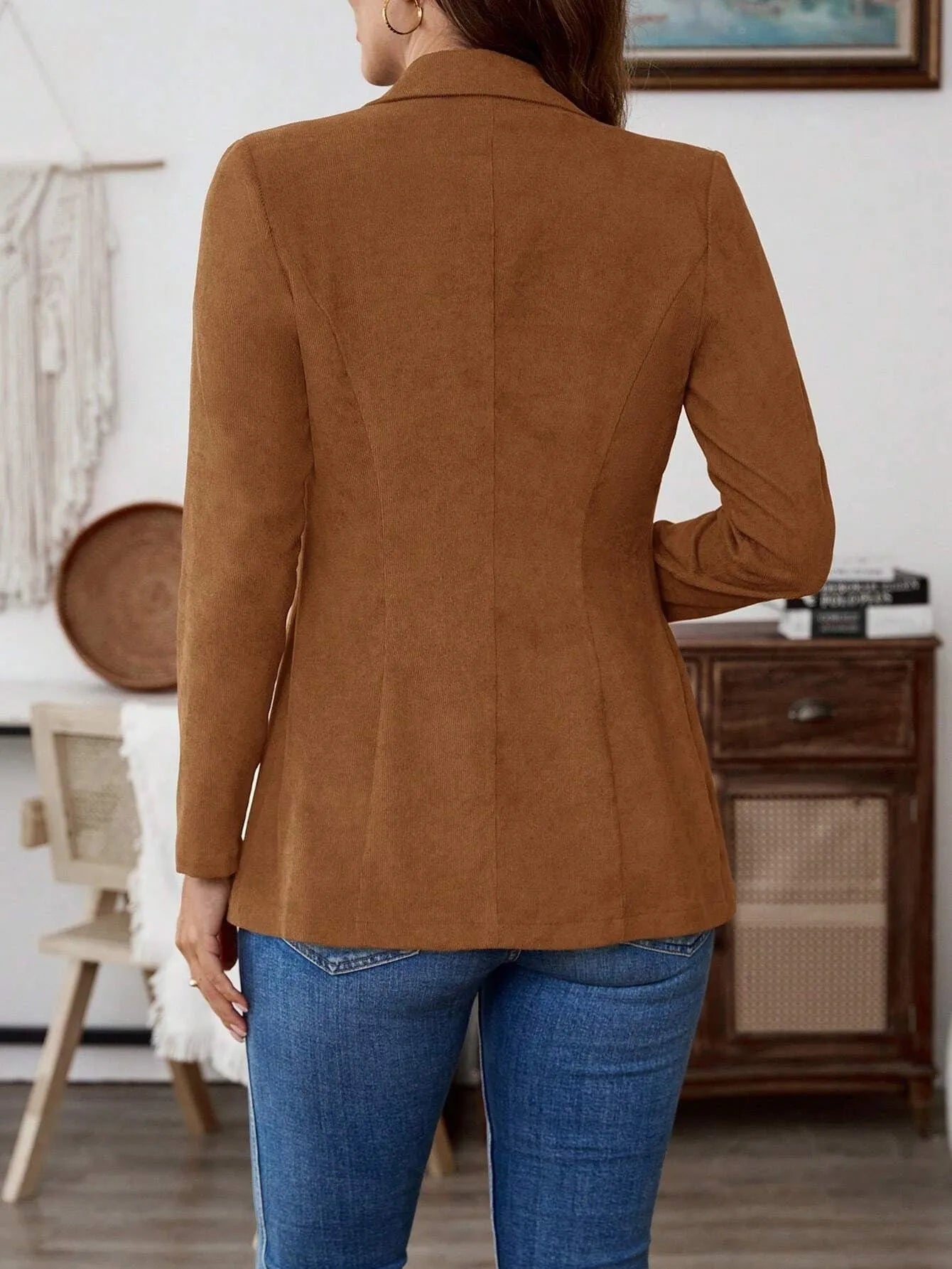 Brown lapel long sleeve single-breasted suit coat on a hanger