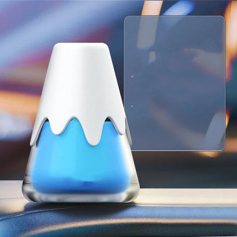 Glass jar car air freshener in choice of scents on a car dashboard.