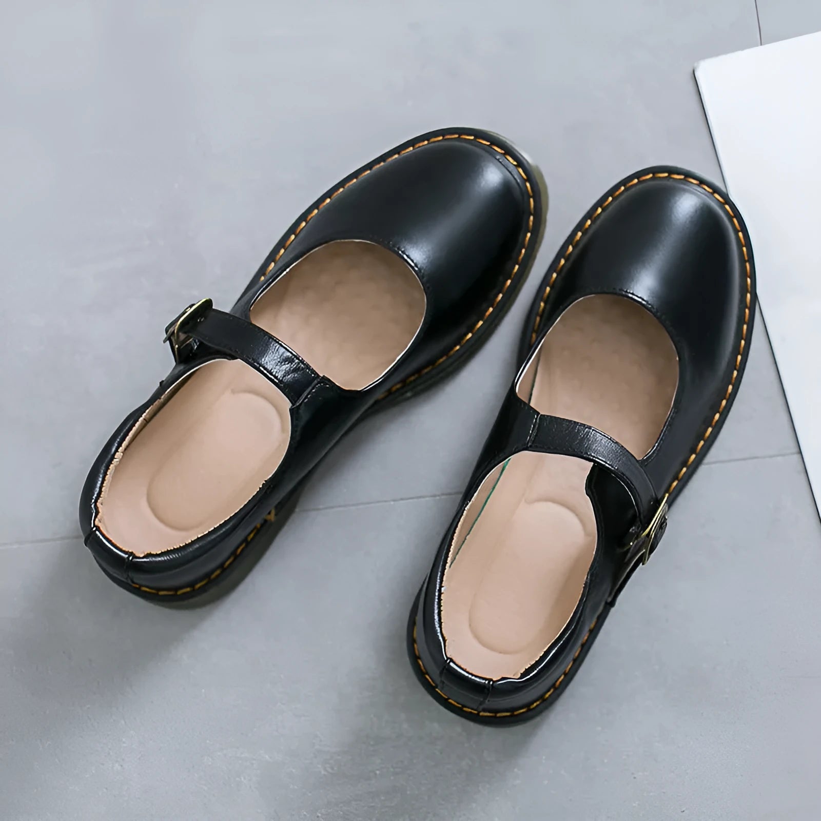 Women's solid colour round head low-cut flat retro shoes with buckle, black colour option, side view