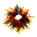 Colourful cloth dog collar with tie dye patterns in seasonal colours