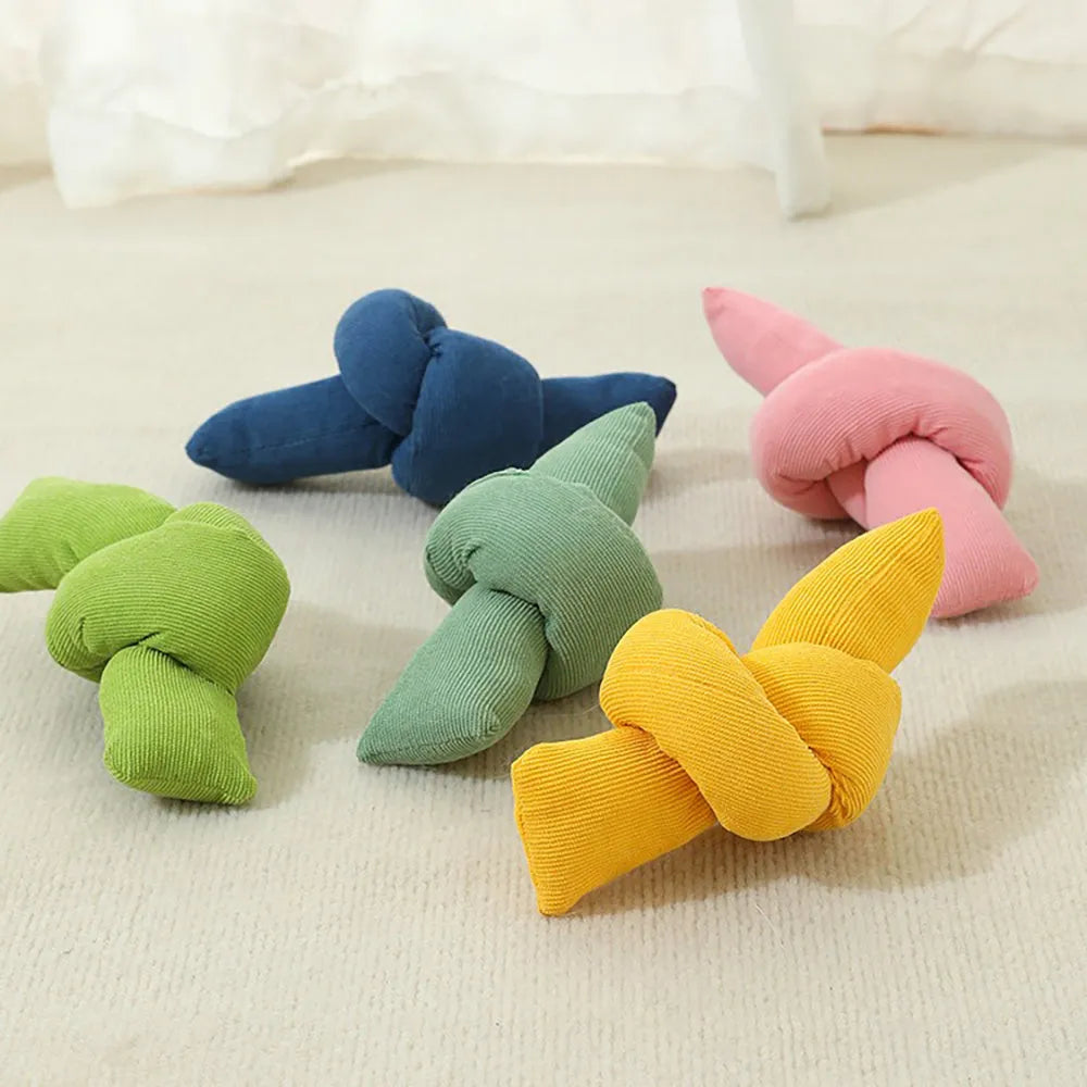 White knotted cotton rope dog toy for tugging and chewing.