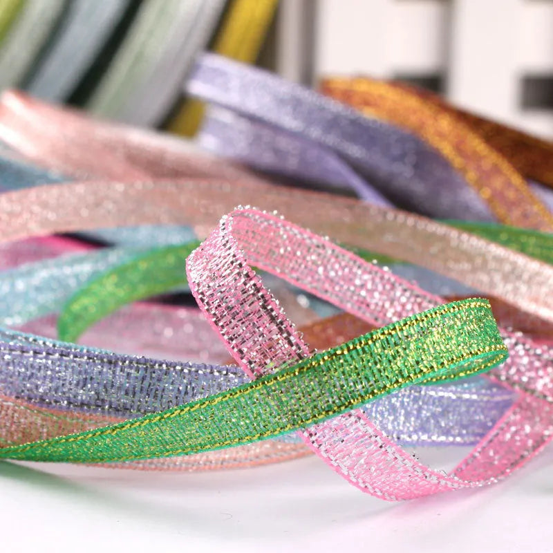 Roll of narrow 0.6cm wide polyester decorative ribbon in multiple colour options including metallic finishes