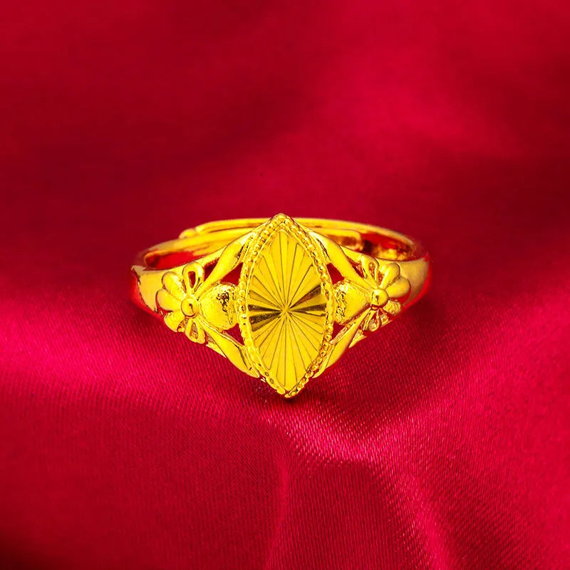Gold open geometry ring with diamond flower pattern and textured botanical detailing