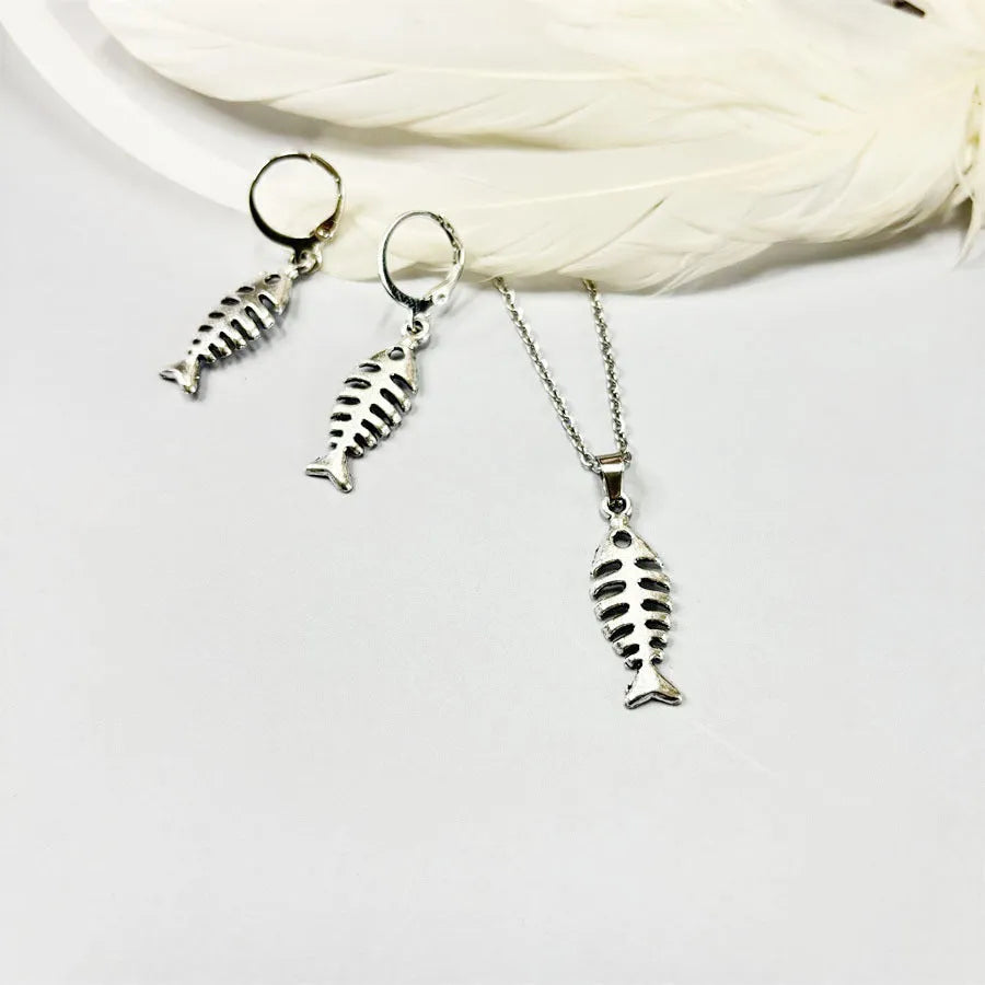 Retro fishbone design alloy necklace and matching earrings set on a dark background.