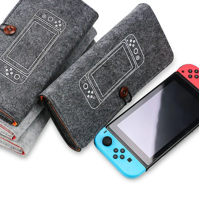 Black felt storage pouch for Nintendo Switch console with game card slots open