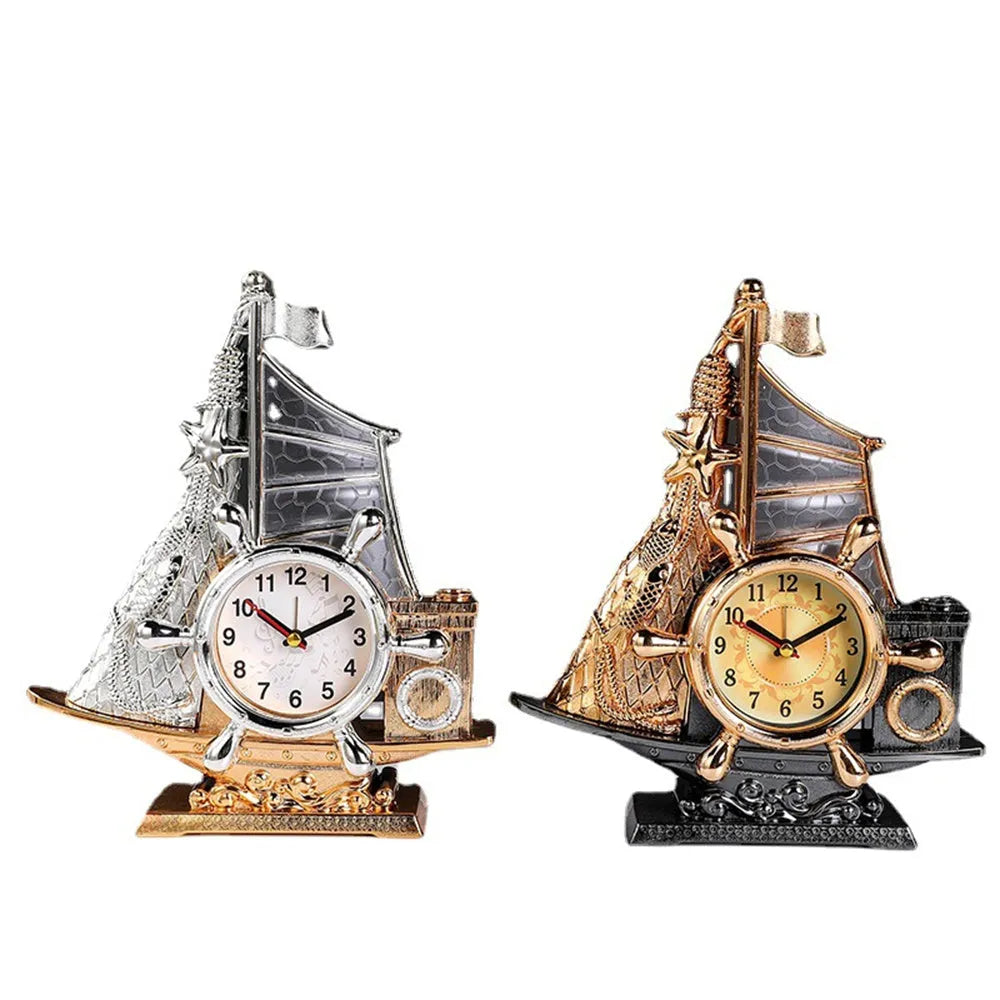 Gold or silver fashion bedroom alarm clock with plastic construction on wooden desk