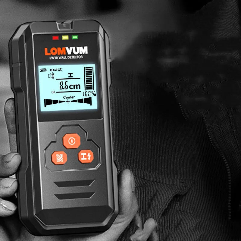 Multifunctional wall detector unit held against a plasterboard wall showing detection depth display