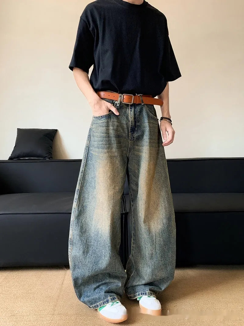 Men's retro blue distressed machete denim jeans with wide-leg silhouette and slim hip fit