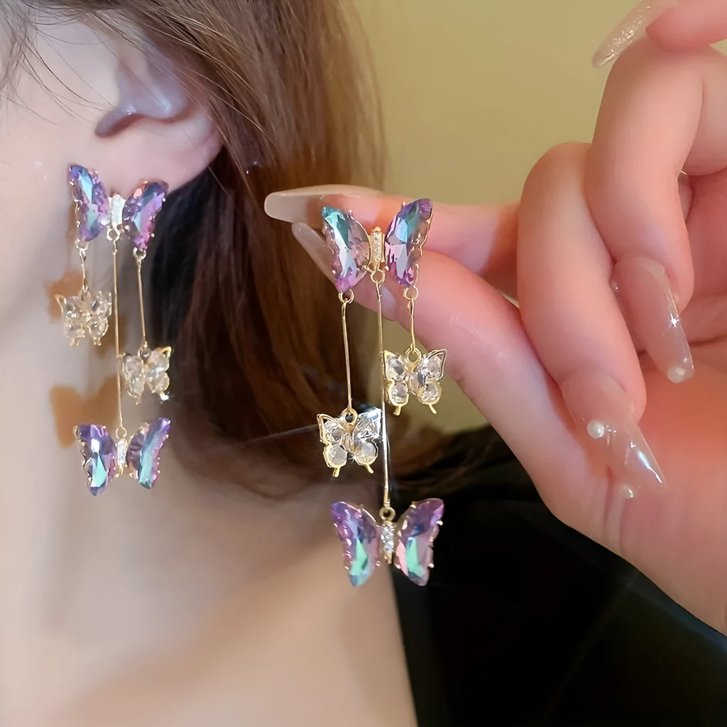 Silver needle crystal flowers butterfly tassel earrings in blue purple colour with electroplated alloy construction