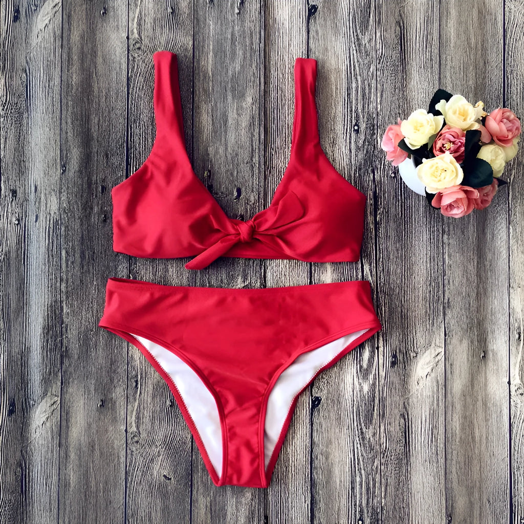 Ladies' polyester bikini set in solid red colour, showing bra top and briefs.