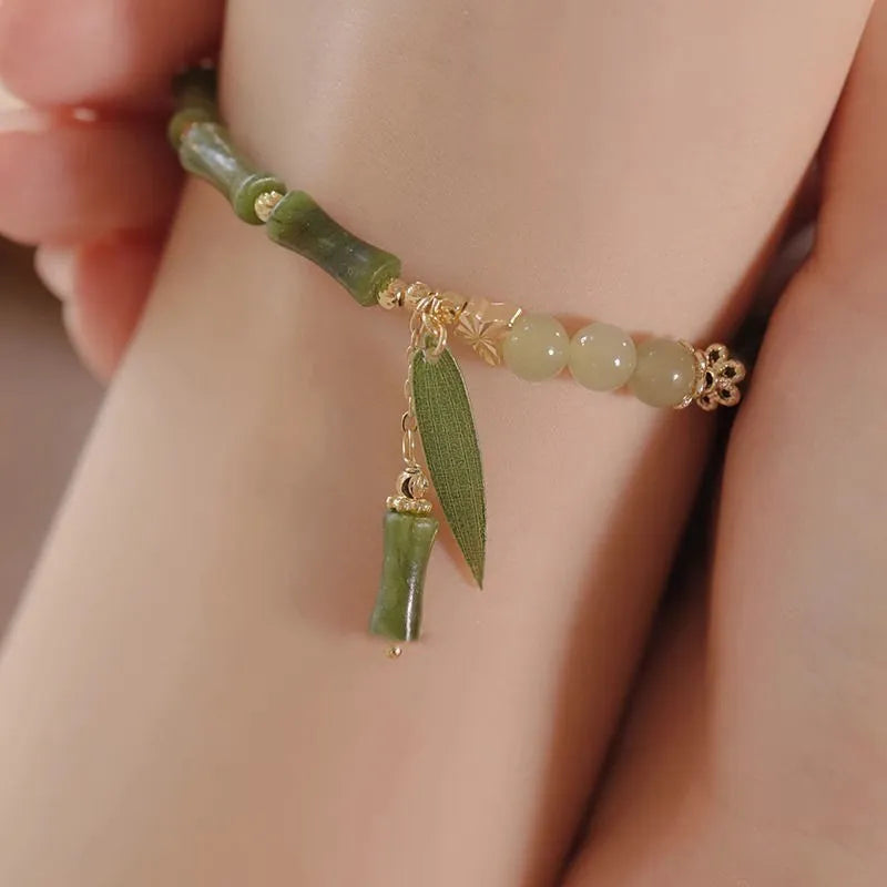 Chinese style bamboo leaf glass bracelet for women with a bamboo joint design.