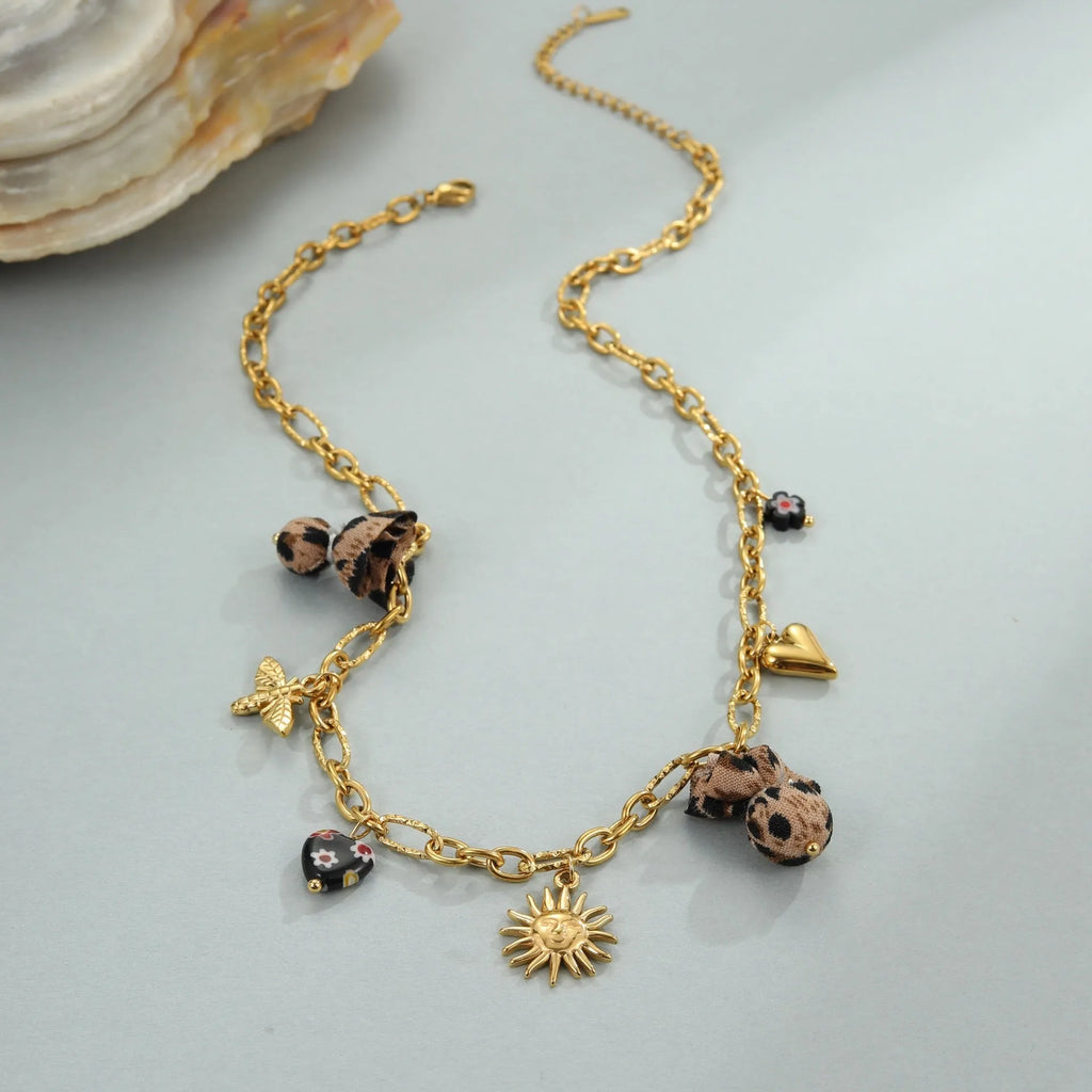 Women's stainless steel necklace with leopard pendant and love heart flowers design