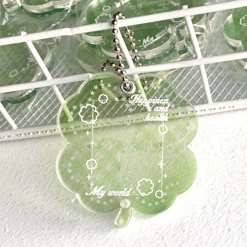 Acrylic four-leaf clover phone pendant keychain in blue, green, or mint green.