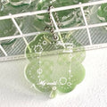 Acrylic four-leaf clover phone pendant keychain in blue, green, or mint green.
