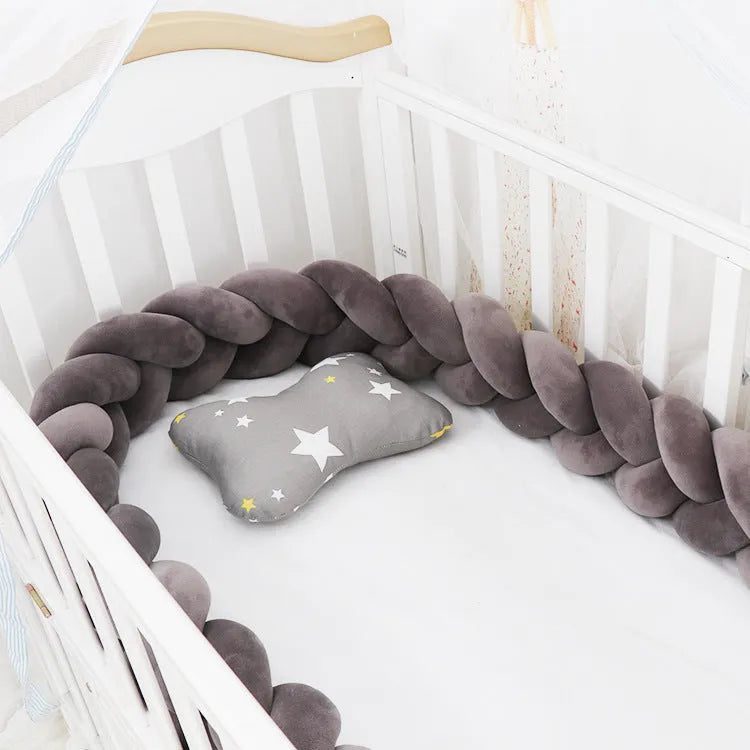 Baby crib bumper braid knot pillow cushion in spandex velvet, shown in a light grey colour