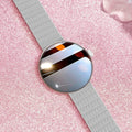Women's circular smart watch with colour screen and metal strap on wrist