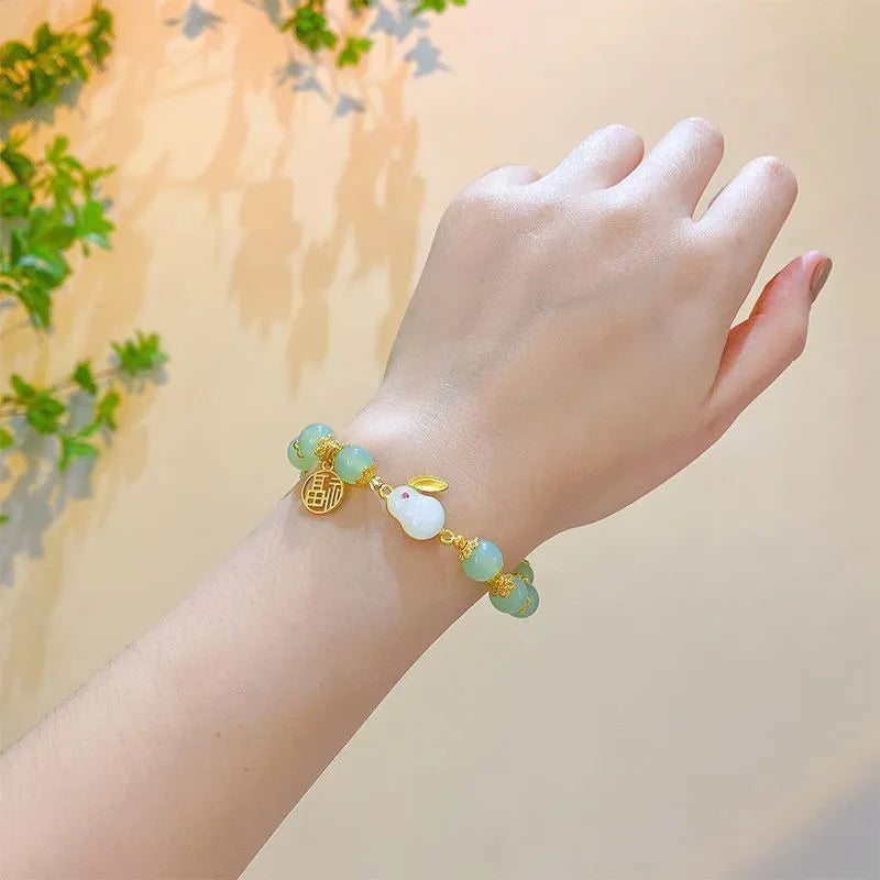Chinese style bamboo leaf glass bracelet for women with a bamboo joint design.