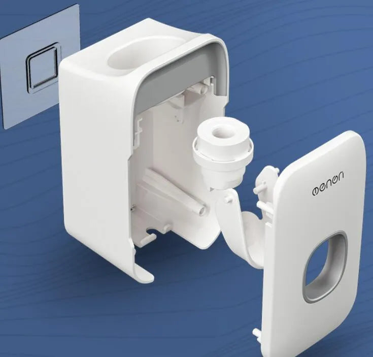 Blue automatic toothpaste dispenser mounted on a bathroom wall with a toothbrush below.