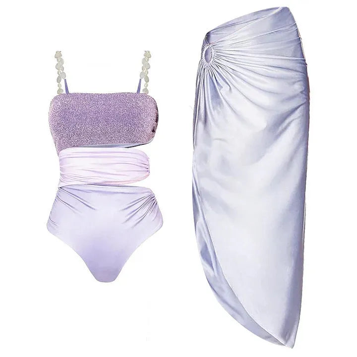 Purple one-piece swimsuit with matching wrap skirt in polyester fabric
