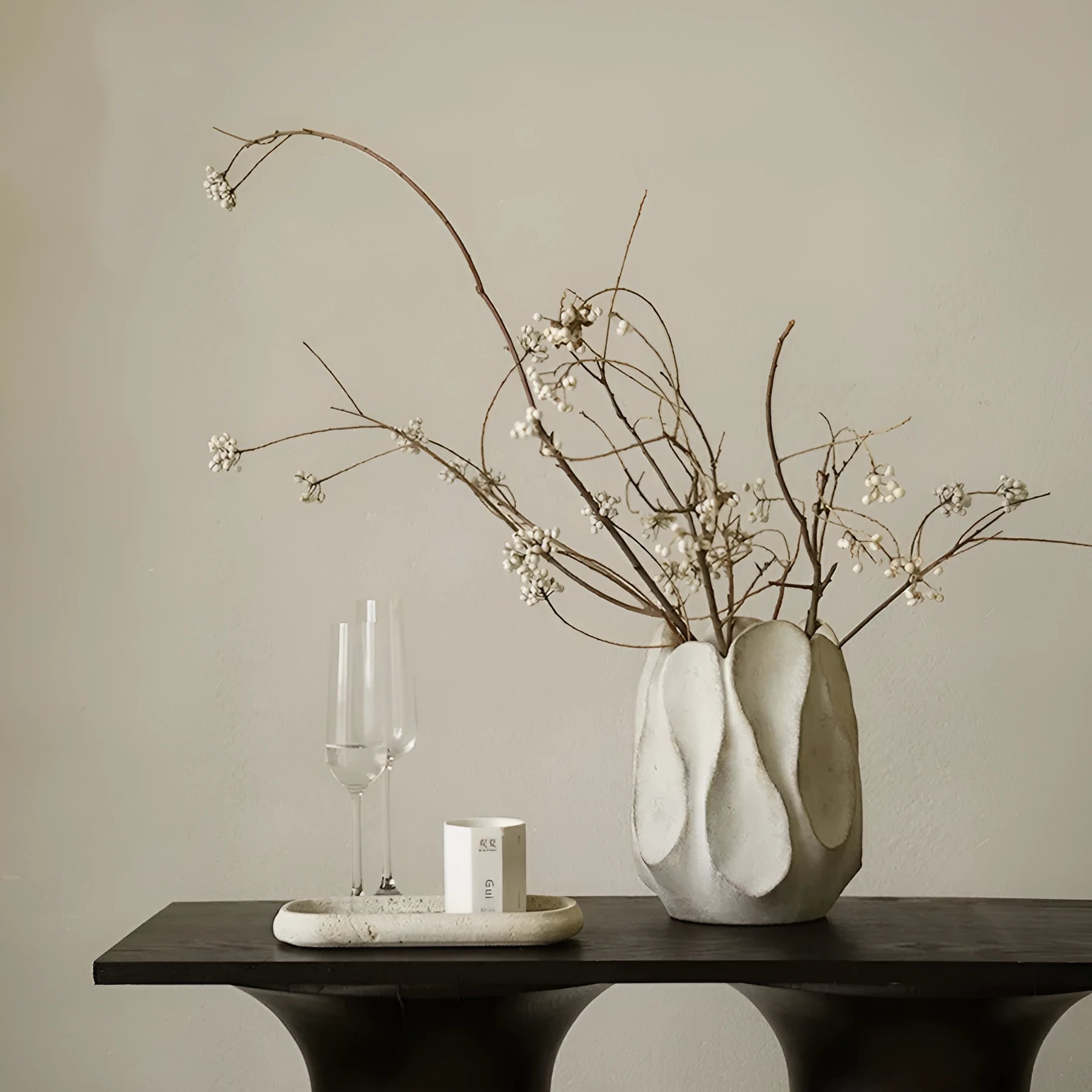 Irregular art ceramic vase in magnesium clay material displayed in high and low style options