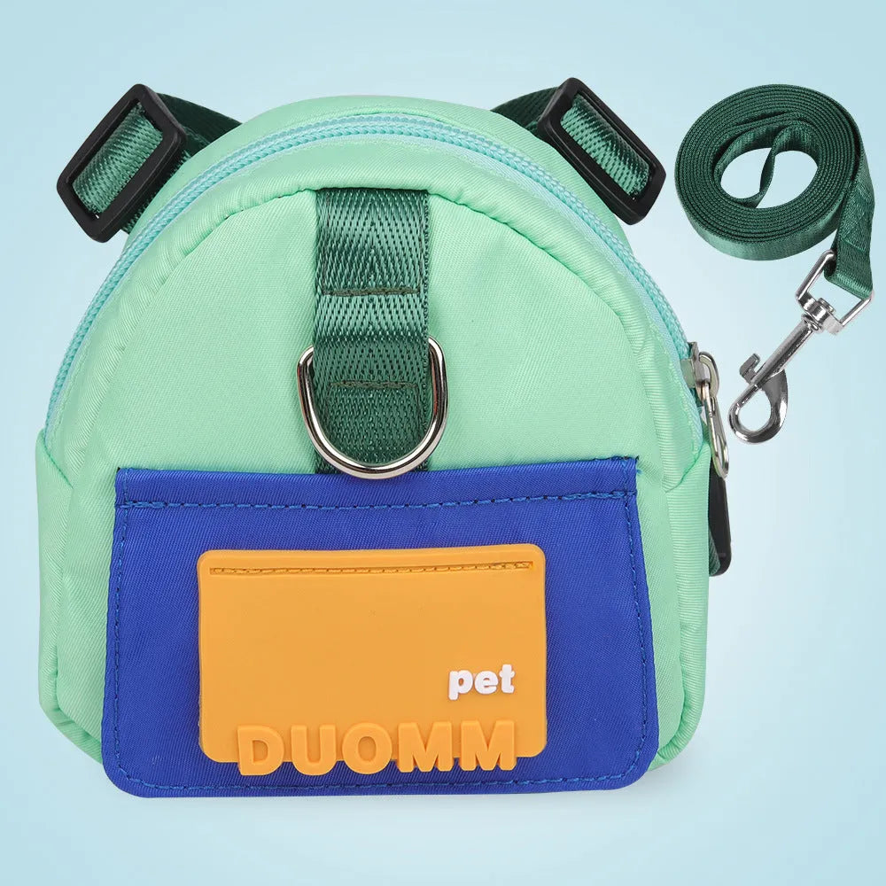 Blue adjustable dog harness with integrated backpack and attached tow rope on a medium-sized dog