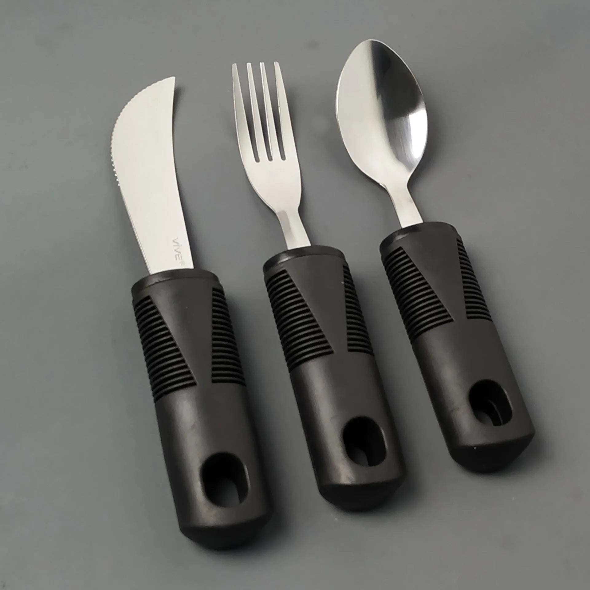 Stainless steel anti-shake cutlery set with rubber handles for adult mealtime assistance