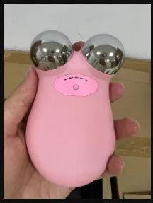 Pink and white micro current facial lifting device for skin firming.
