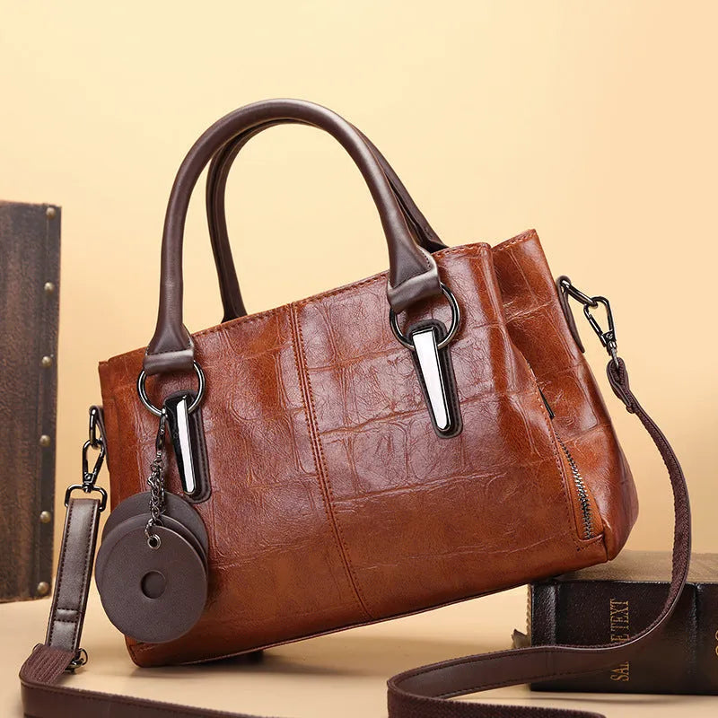Horizontal square PU leather shoulder bag with contrasting sewing thread detail and organised interior compartments