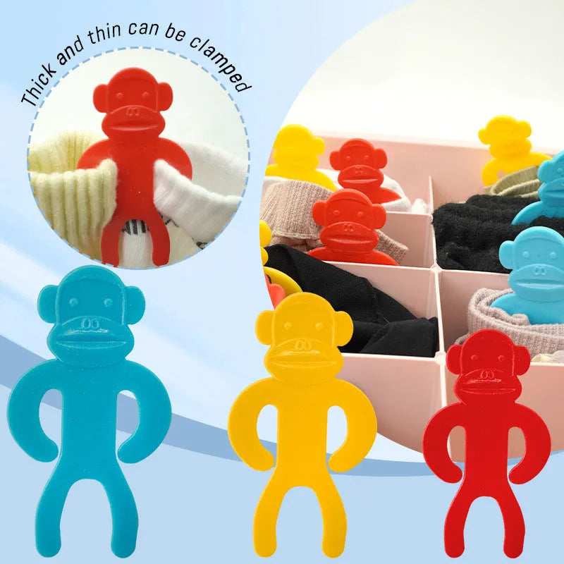 Plastic anti-winding socks clips in blue, yellow, and red colours for laundry organisation