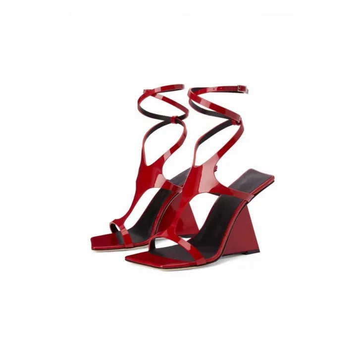 Black women's strappy high heel sandals with a square toe and ankle buckle on a 9.5cm rubber heel.