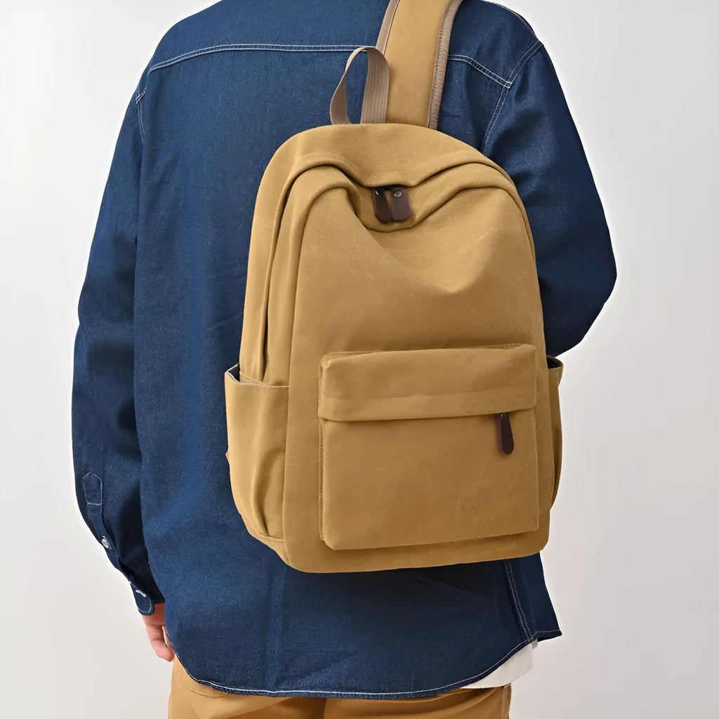 Canvas large capacity travel backpack in solid colour for men and women, available in brown
